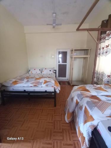 Letto o letti in una camera di Rafiki Apartment