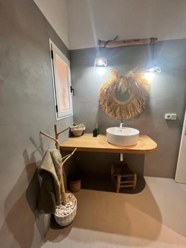 a bathroom with a counter with a sink in it at Casa Italia Vivienda Turistica ET6132 in Es Caló