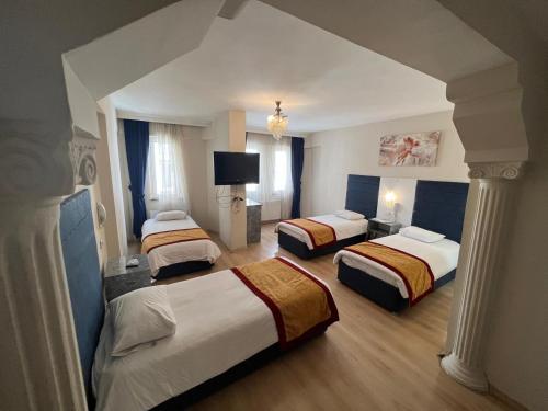 Postel nebo postele na pokoji v ubytování Hotel Yakut
