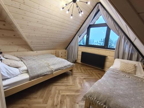 Tempat tidur dalam kamar di Tatry u Tatara