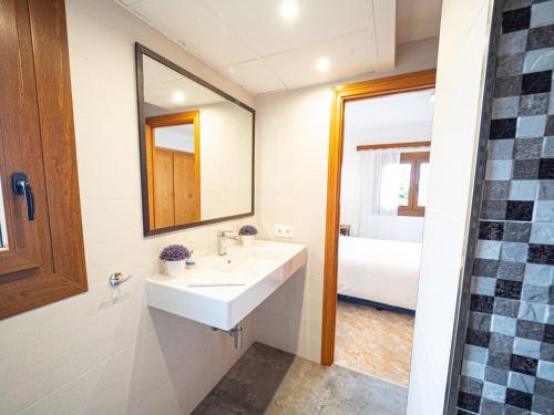 a bathroom with a sink and a mirror at Son Serra II in Son Serra de Marina