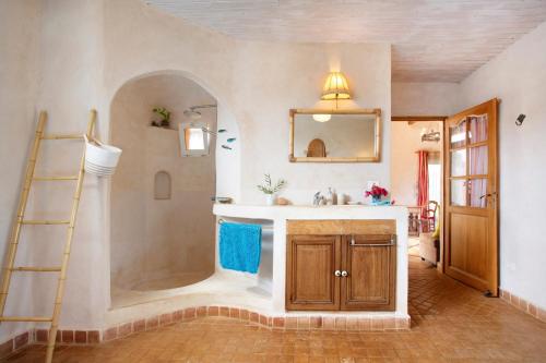 a bathroom with a shower and a sink at La Agüita in playa del Águila
