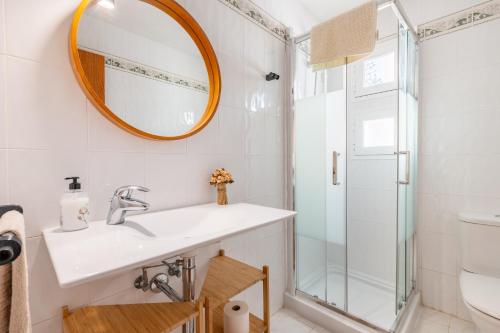 a bathroom with a sink and a shower at Villa Mar - Can Bujosa in Palma de Mallorca