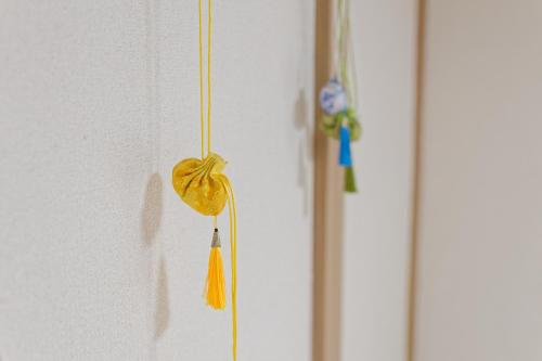 a yellow teddy bear hanging on a wall at Tokyo Shinjuku hotel in Tokyo