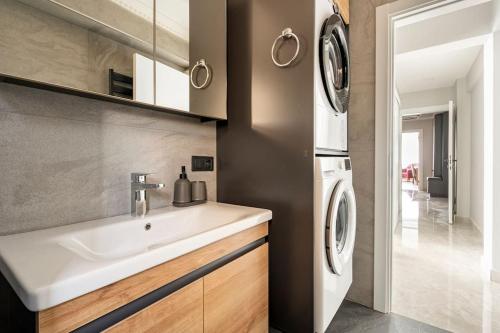 a kitchen with a sink and a washing machine at Tomtom HOUSE Centre Location in Istanbul