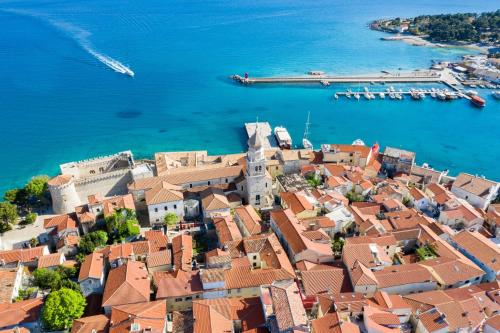 an aerial view of a town next to the water at Apartments Sinisa - Krk Town in Krk