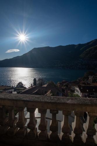 a view of a body of water from a balcony at VILLA MARIA in Torno