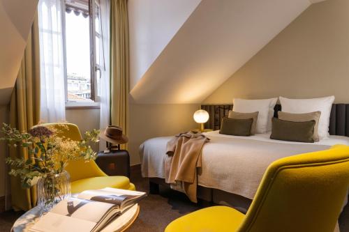 Postel nebo postele na pokoji v ubytování Hotel D Geneva