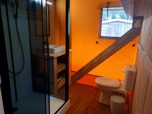 a bathroom with a sink and a toilet and a staircase at The Chilterns View in Wallingford