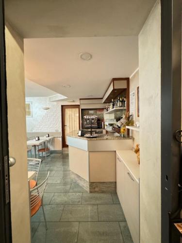 a kitchen with a stove and a counter top at Hotel Le Querce in Milan
