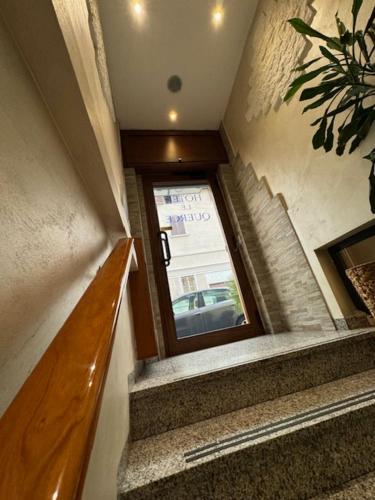 a stairway with a window in a building at Hotel Le Querce in Milan