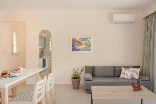 a kitchen and living room with a couch and a table at Levantes Villa in Divarata