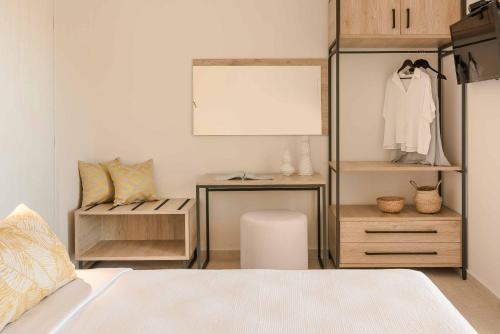 a bedroom with a dresser and a bed with a mirror at Levantes Villa in Divarata