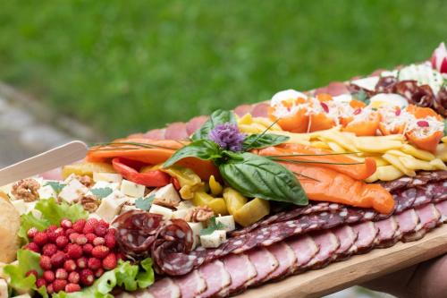 a plate of food with vegetables on a table at Turizem na kmetiji Rdečnik in Slovenj Gradec