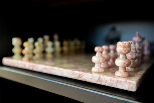 a chess board with chess pieces on a table at Chalet Luméo in Brownsburg