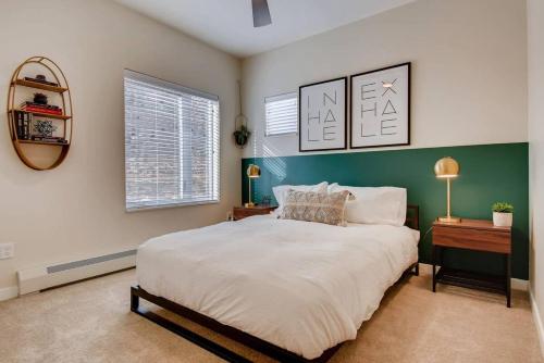 a bedroom with a large bed and two windows at Hiker's Haven Close to Slopes Georgetown in Georgetown