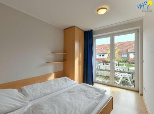 Postel nebo postele na pokoji v ubytování Ferienhäuser Jadehörn Ferienhaus Casa Verde