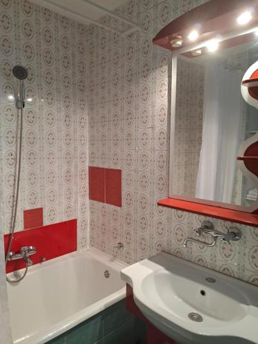 a bathroom with a white tub and a sink at Accommodation Zara in Vukovar
