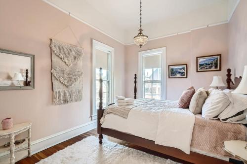 a bedroom with a large bed and a window at Woods Manor Walk to Downtown Built in 1887 in Denver