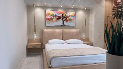 Postel nebo postele na pokoji v ubytování La Perla Apartments