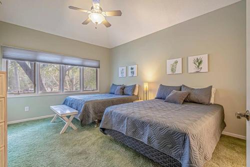 a bedroom with two beds and a ceiling fan at Tidewater Golf Community 722 Teal Lake in North Myrtle Beach