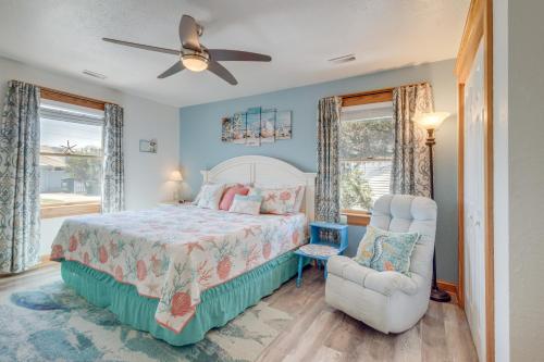a bedroom with a bed and a chair at Coastal Home with Deck, Outdoor Shower Walk to Beach in Kill Devil Hills