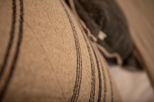 a close up of the seams of a brown shoe at Albades Hotel & Spa - Adults Only in Benicàssim