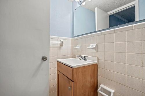 a bathroom with a sink and a mirror at Charming Condo one block from the beach - WR 301 in Myrtle Beach