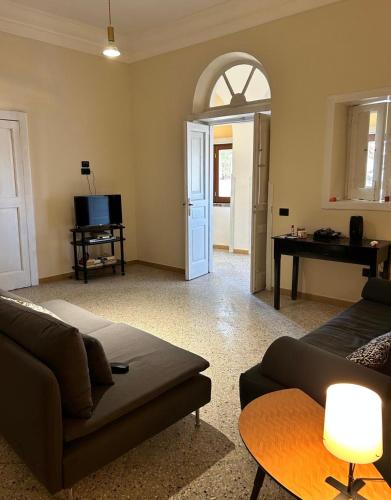a living room with a couch and a table at Palazzo Conforti in Calvanico