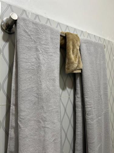 a towel hanging on a rack in a bathroom at Home Stays Juba in Juba