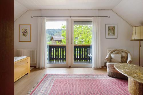 a living room with a large sliding glass door at Zum Alt Engelwirt in Horben