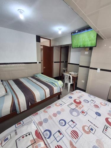 Ένα ή περισσότερα κρεβάτια σε δωμάτιο στο Hostal Jovita
