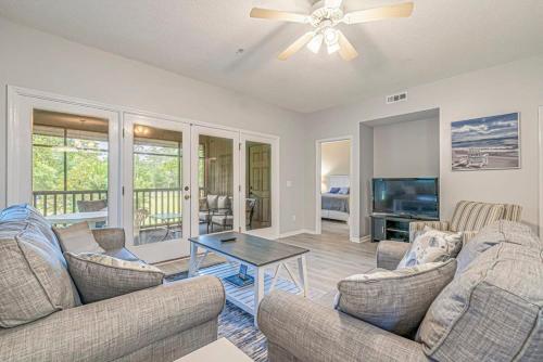a living room with two couches and a table at Teal Lake Villas 1523 Golf Villa in North Myrtle Beach
