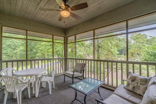a screened in porch with a table and chairs at Teal Lake Villas 1523 Golf Villa in North Myrtle Beach