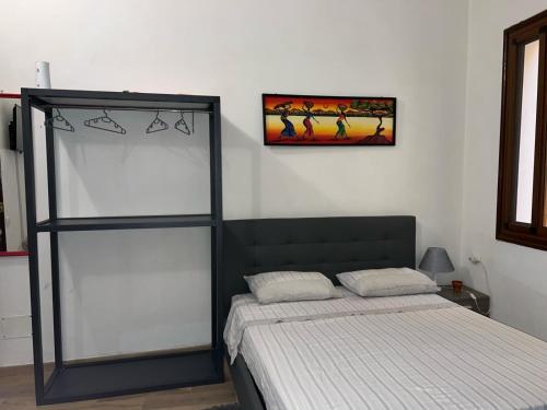 Een bed of bedden in een kamer bij Il sole della Sicilia