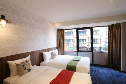 Postel nebo postele na pokoji v ubytování Ark Hotel - Changan Fuxing方舟商業股份有限公司