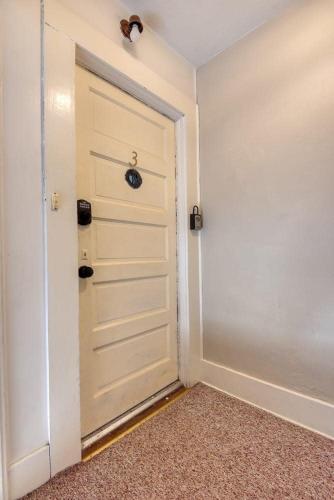 an empty room with a door in a room at #StayinMyDistrict Historic Apartment Near Downtown in Coos Bay