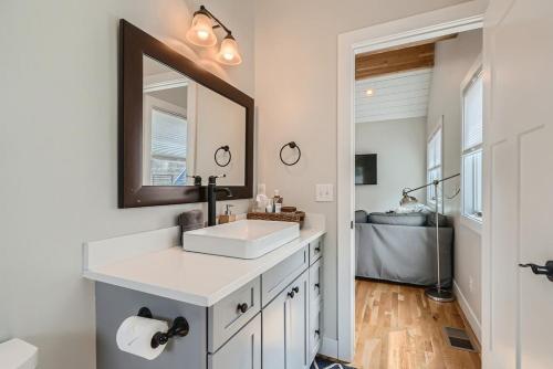 a bathroom with a sink and a mirror at Berkeley Hidden Gem 1BR Full Kitchen w Patio in Denver
