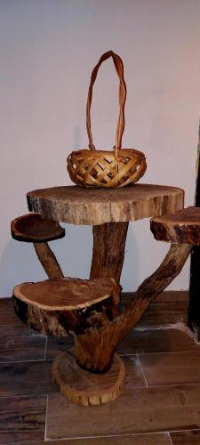 a basket sitting on top of a wooden table at Golemi kamik Pirot Vlasi 4 in Pirot