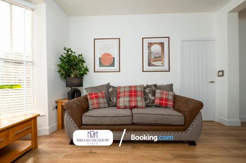 a living room with a brown couch in a room at Heart of City, 3 Bed House By Broad Meadow Stays Short Lets and Serviced Accommodation Lincoln With Free Wi-Fi in Lincolnshire