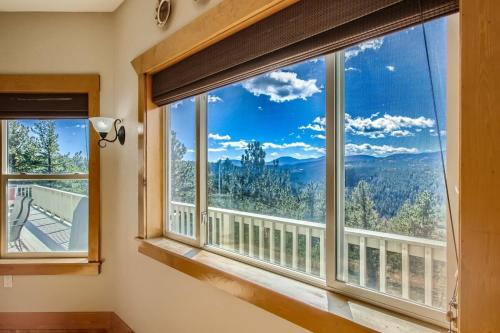 a room with a large window with a mountain view at Mountain Retreat Sauna Deck Views Sleeps 10 in Black Hawk