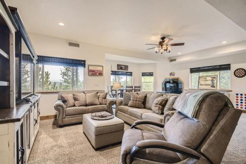 a living room with a couch and a tv at Mountain Retreat Sauna Deck Views Sleeps 10 in Black Hawk