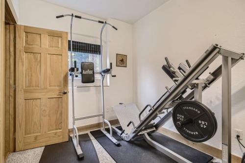 a room with a gym with a treadmill at Mountain Retreat Sauna Deck Views Sleeps 10 in Black Hawk