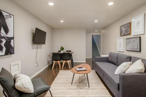 a living room with a couch and a table at #StayInMyDistrict Piedmont Near Parks and Shopping in Portland