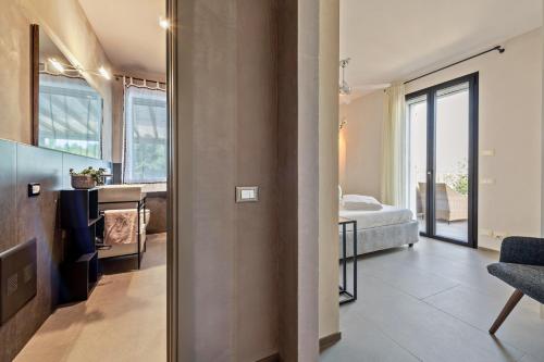 a living room with a view of a bedroom at Villa Artista in Gardone Riviera
