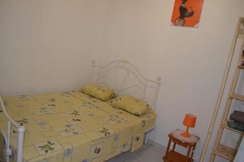 Giường trong phòng chung tại L'Authentique Sikryé