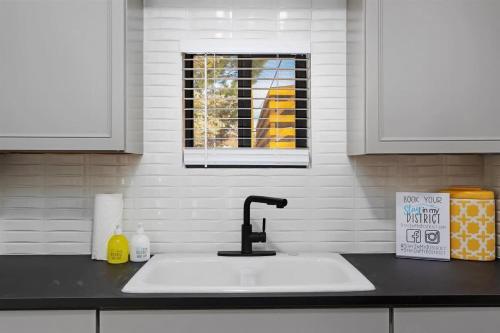a kitchen counter with a sink and a window at #StayinMyDistrictTwinFalls Tudor in Twin Falls