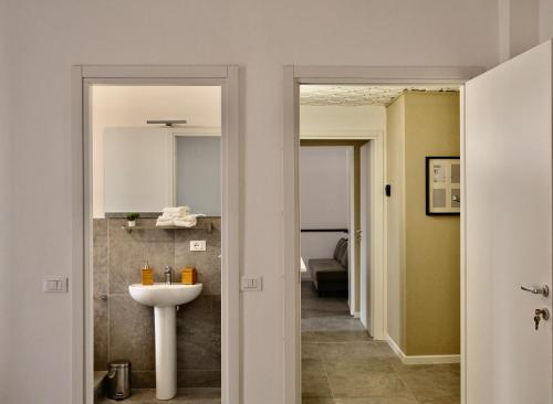 a bathroom with a sink and a toilet at La Casa di Cloe in La Spezia
