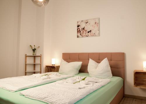 Ένα ή περισσότερα κρεβάτια σε δωμάτιο στο Apartmenthaus Rankestraße 4