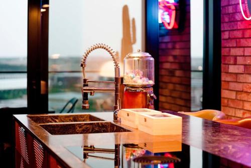 a kitchen counter with a sink and a sink at Designer Luxury Penthouse with dedicated concierge in Luxembourg